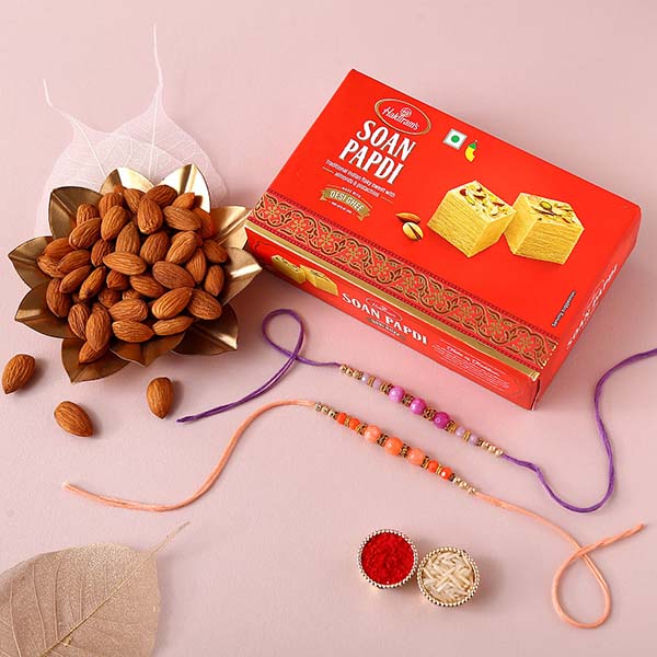 Peachy Rakhi Set with Soan Papdi and Almonds-Dubai