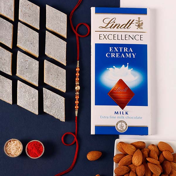 Rose Gold Pearl And Beads Rakhi with Lindt Bar and Kaju Katli