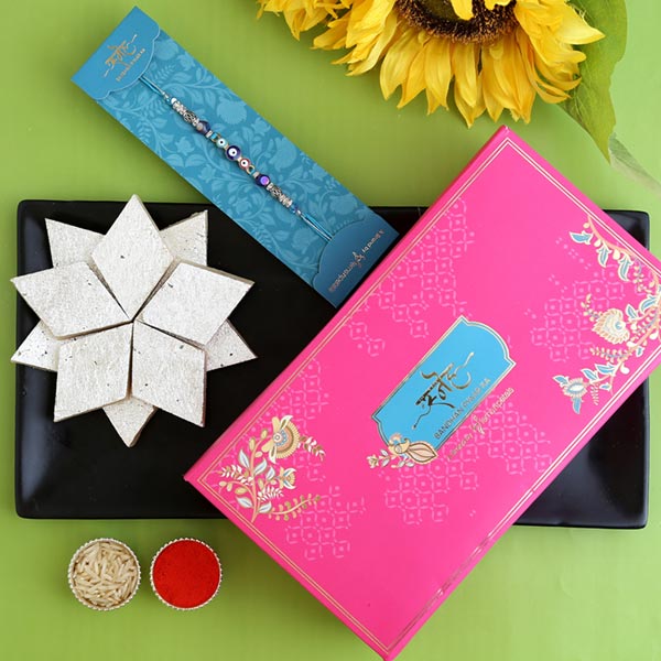 Auspicious Evil Eye Designer Rakhi And Kaju Katli
