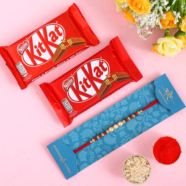 Traditional Pearl Studded Mauli Rakhi And 2 Pcs Of Kitkat