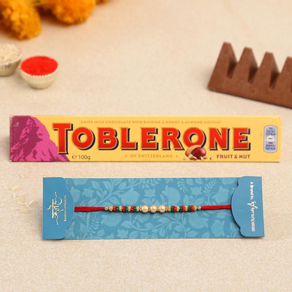 Traditional Pearl Studded Mauli Rakhi And Toblerone Chocolate