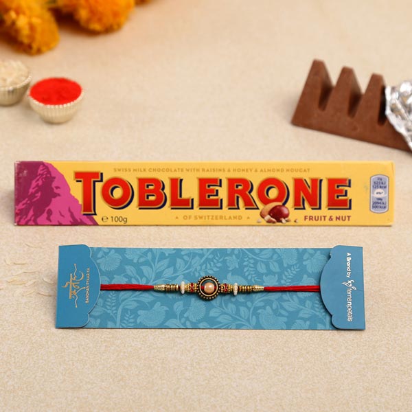 Pearl In A Circle Rakhi And Toblerone Chocolate