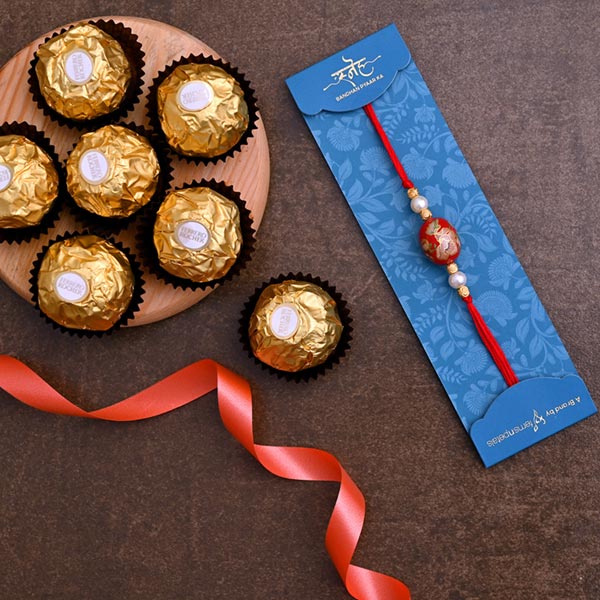 Japanese Red Stone Rakhi And 3 Pcs Ferrero Rocher