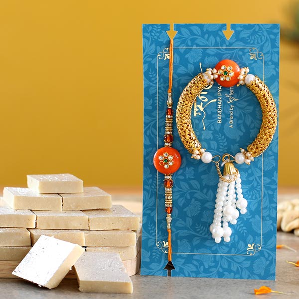 Orange Pearl And Lumba Rakhi Set With Kaju Katli