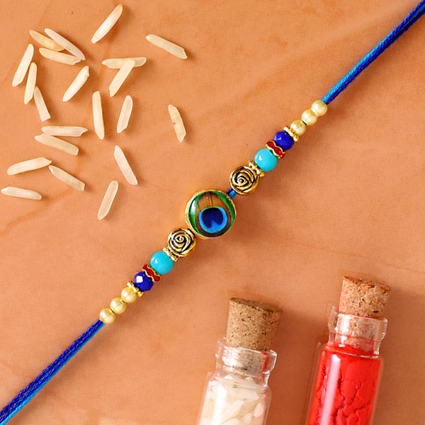 Circular Peacock Feather Rakhi