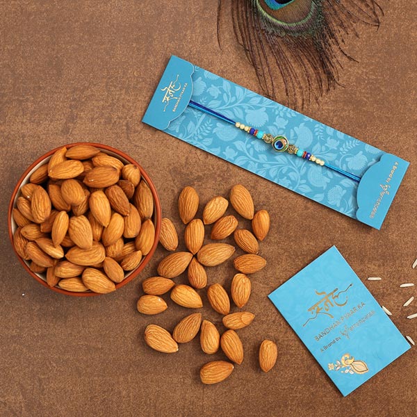 Circular Peacock Feather Rakhi And Healthy Almonds