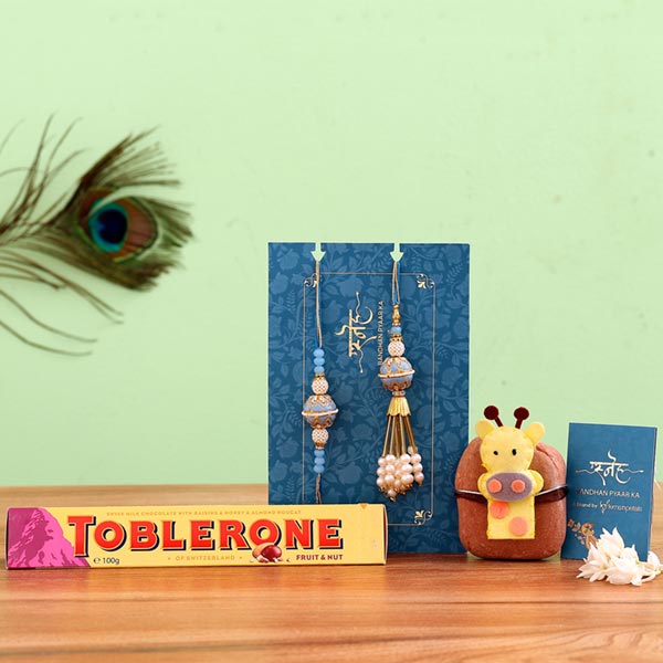 Blue Orb Lumba Rakhi Set & Giraffe Rakhi With Toblerone