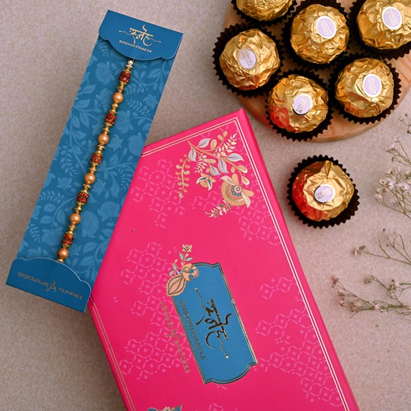 Traditional Golden Pearl Rakhi And 3 Pcs Ferrero Rocher