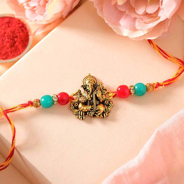Mor Rakhi Send Ganesh Mauli Rakhi with Roli Chawal - USA Online | Rakhibazaar.com