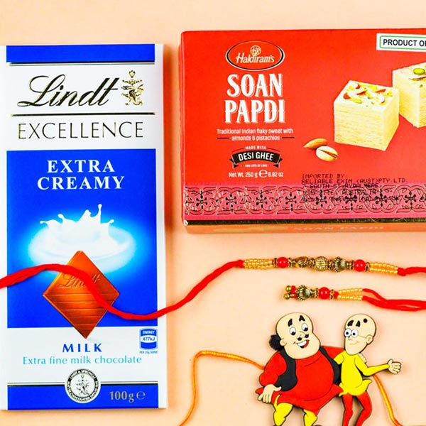 Beautiful Bhaiya Bhabhi & Kids Set Of 3 Rakhis With Lindt Chocolate & Soan Papdi