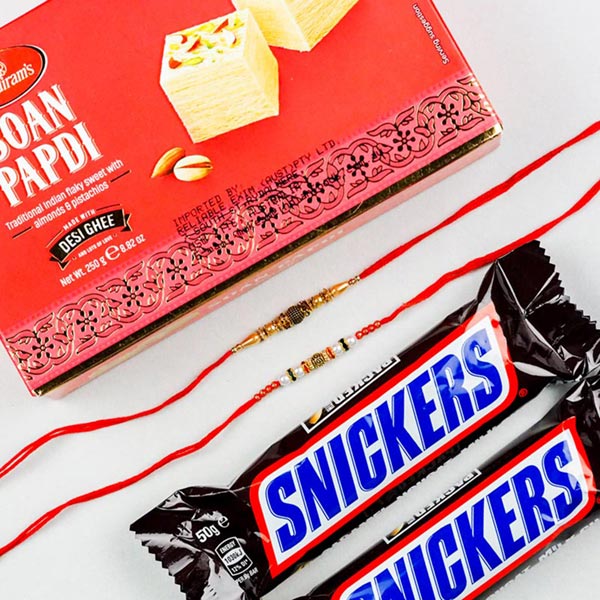 White Golden Pearl Set of 2 Rakhis With Soan Papdi & Snickers